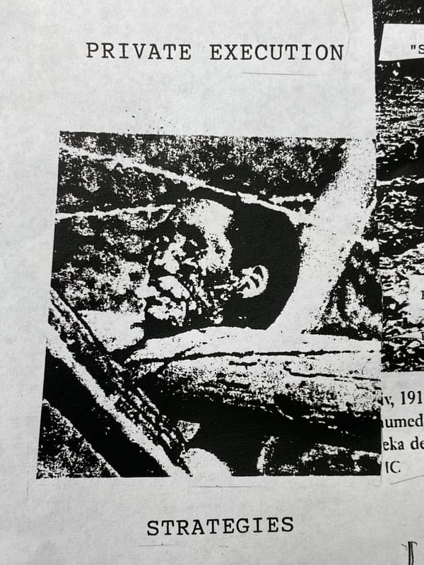 Severed Head Placed On A Barbed Wire Barricade With A Cigarette Butt Placed Between It’s Lips